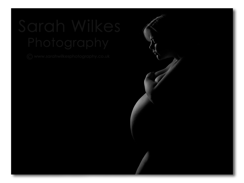 Black and white nude maternity shot rim lighting